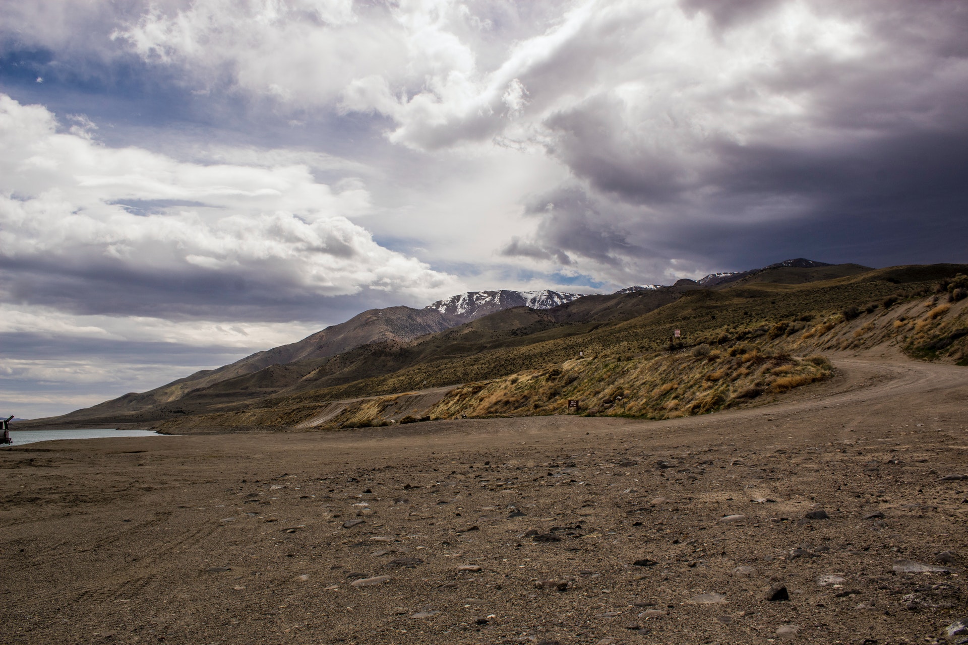 A photograph of a mountain under a cloudy sky